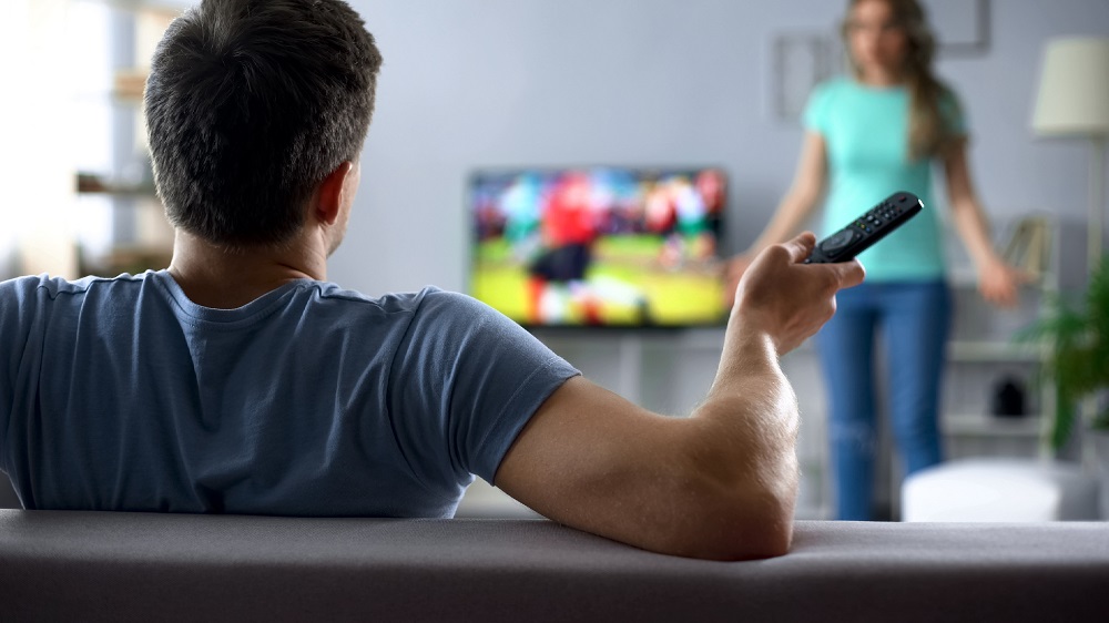 Angry,Wife,Quarreling,With,Husband,Watching,Football,Game,,Conflict,In