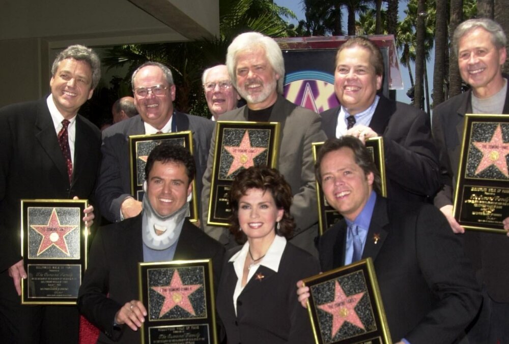 Jay Osmond, Merrill Osmond, Vernon Osmond, Andy Williams, Jimmy Osmond, Alan Osmond, Wayne Osmond, Tom Osmond, Johnny Grant, Donny Osmond, Marie Osmond, Leron Gubler, Hollywood Walk Of Fame, California, 2003