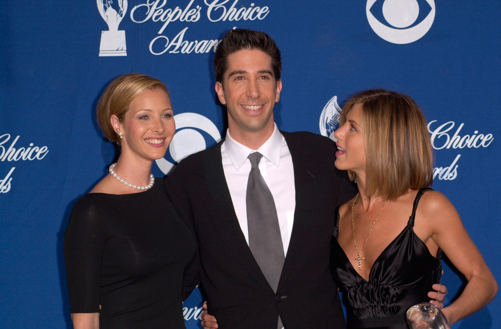 Lisa Kudrow and Jennifer Aniston with FRIENDS costar David Schwimmer. FeatureFlash Photo Agency, Shutterstock