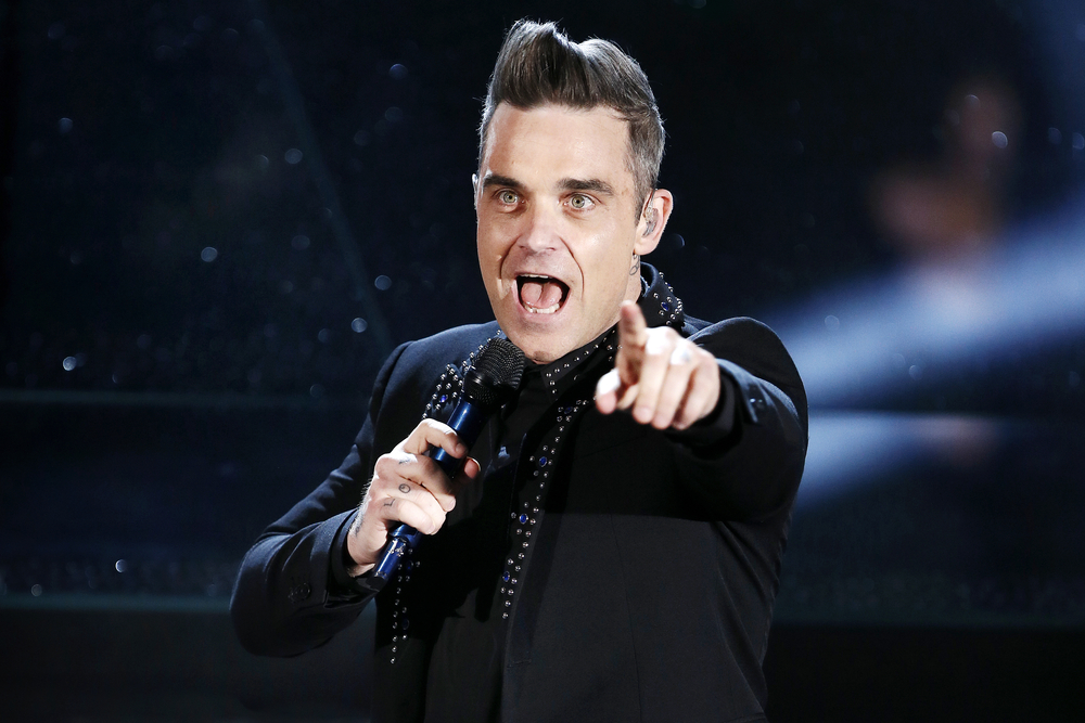 Singer Robbie Williams performs in 2017, in Italy. Andrea Raffin, Shutterstock