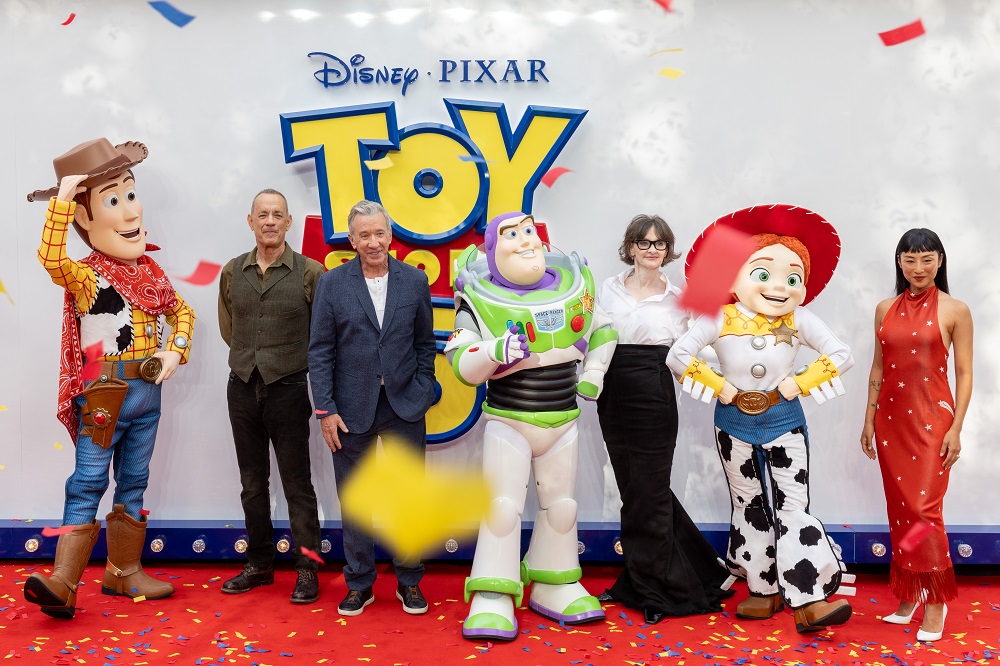 (L to R) Woody, Tom Hanks, Tim Allen, Buzz Lightyear, Joan Cusack, Jessie and Greta Lee attend the UK Launch Event of Disney and Pixar's 'Toy Story 5' at Odeon Luxe Leicester Square, London on May 28th, 2026. (Photo by StillMoving.Net for The Walt Disney Company Limited)