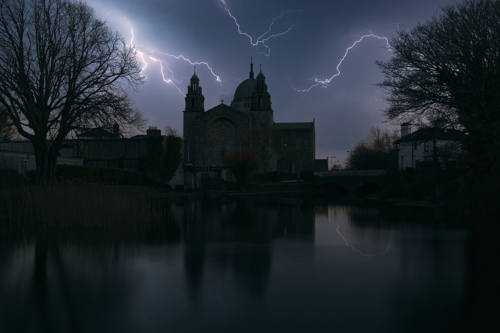 Thunderstorm over Galway cathedral by the Corrib River at Galway City in Ireland
