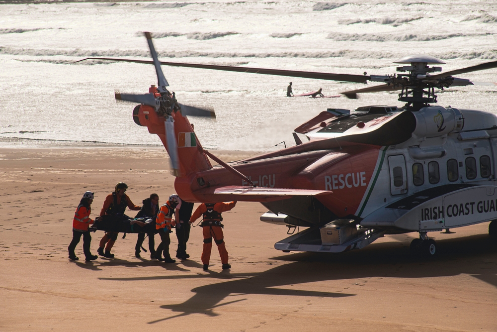 Lahinch, Ireland OCTOBER 1 2022: Irish coast guard, Sikorsky helicopter, beach rescue mission. Photo credit: Marek Pores, Shutterstock