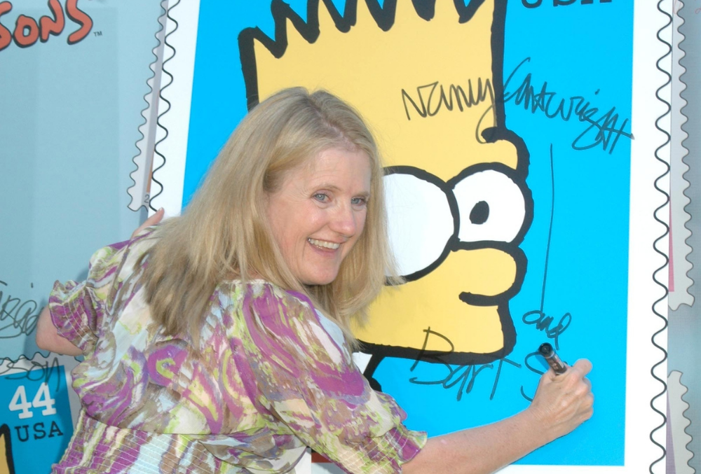 Nancy Cartwright signs Bart Simpson limited edition postal stamp, 2009 LA. S Buckley, Shutterstock